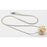 A Sterling Silver Necklace with Cluster Faux Seed Pearl Pendant and a pair of silver swirl stud