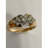 Spectacular 14 carat GOLD and DIAMOND RING.Having sparkling clear DIAMONDS set to top in a floral