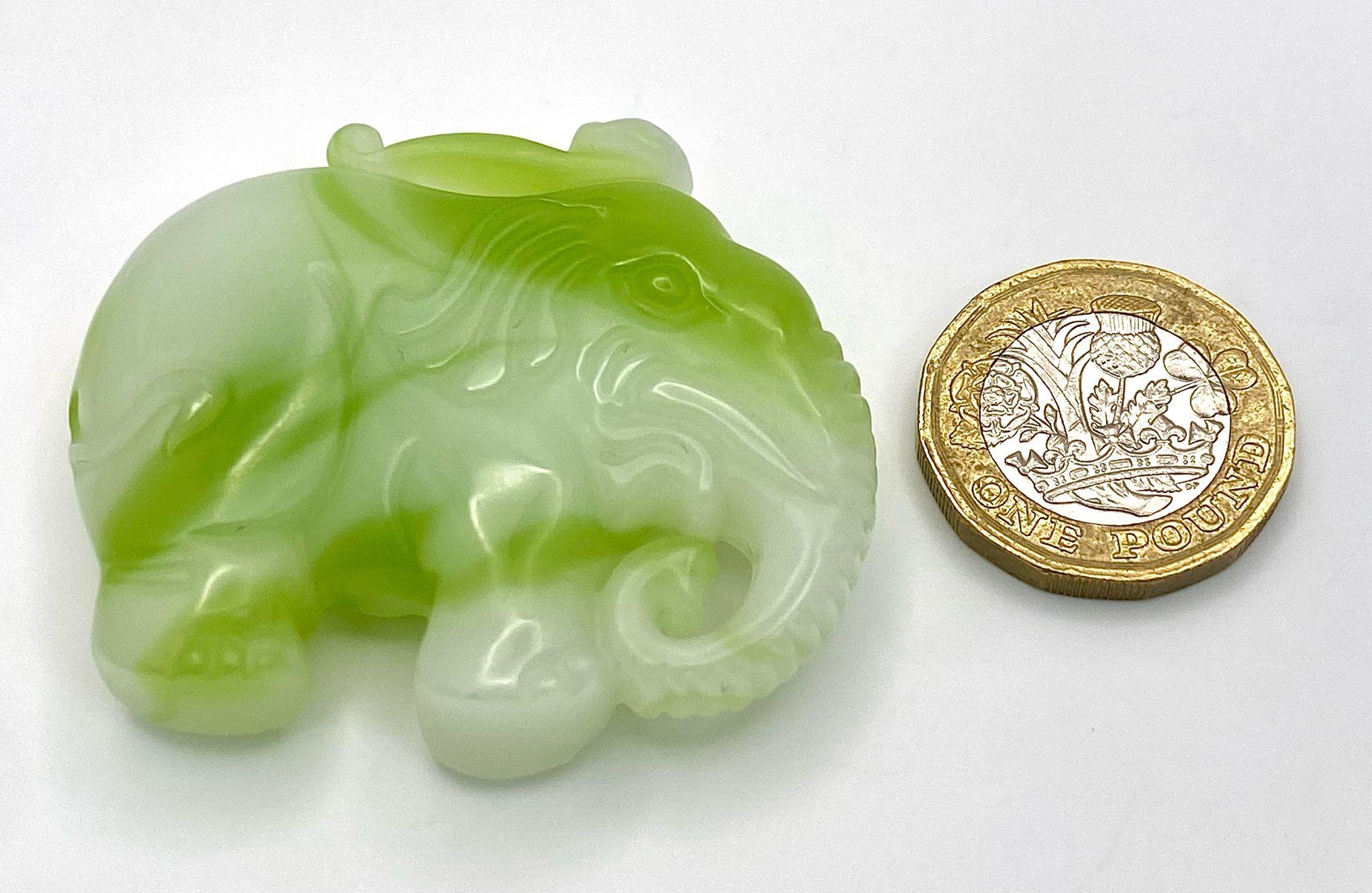 A Chinese Green and White Jade Elephant Figurine Pendant. 5cm x 4cm. - Image 2 of 2