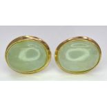 A Pair of 9K Yellow Gold and Jade Stud Earrings. 1cm length, 1.5g total weight.