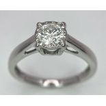 An 18K White Gold Diamond Solitaire Ring. 0.65ct brilliant round cut diamond. Size M. 2.75g total