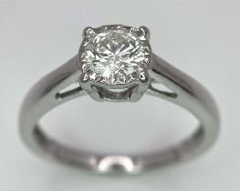 An 18K White Gold Diamond Solitaire Ring. 0.65ct brilliant round cut diamond. Size M. 2.75g total