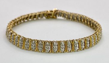 A 9K Yellow Gold Diamond Tennis Bracelet. 18cm length. 12.3g total weight.