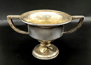 An Antique Small Sterling Silver Two Handled Trophy. Hallmarks for Birmingham 1918. 9cm tall. 121g