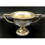 An Antique Small Sterling Silver Two Handled Trophy. Hallmarks for Birmingham 1918. 9cm tall. 121g