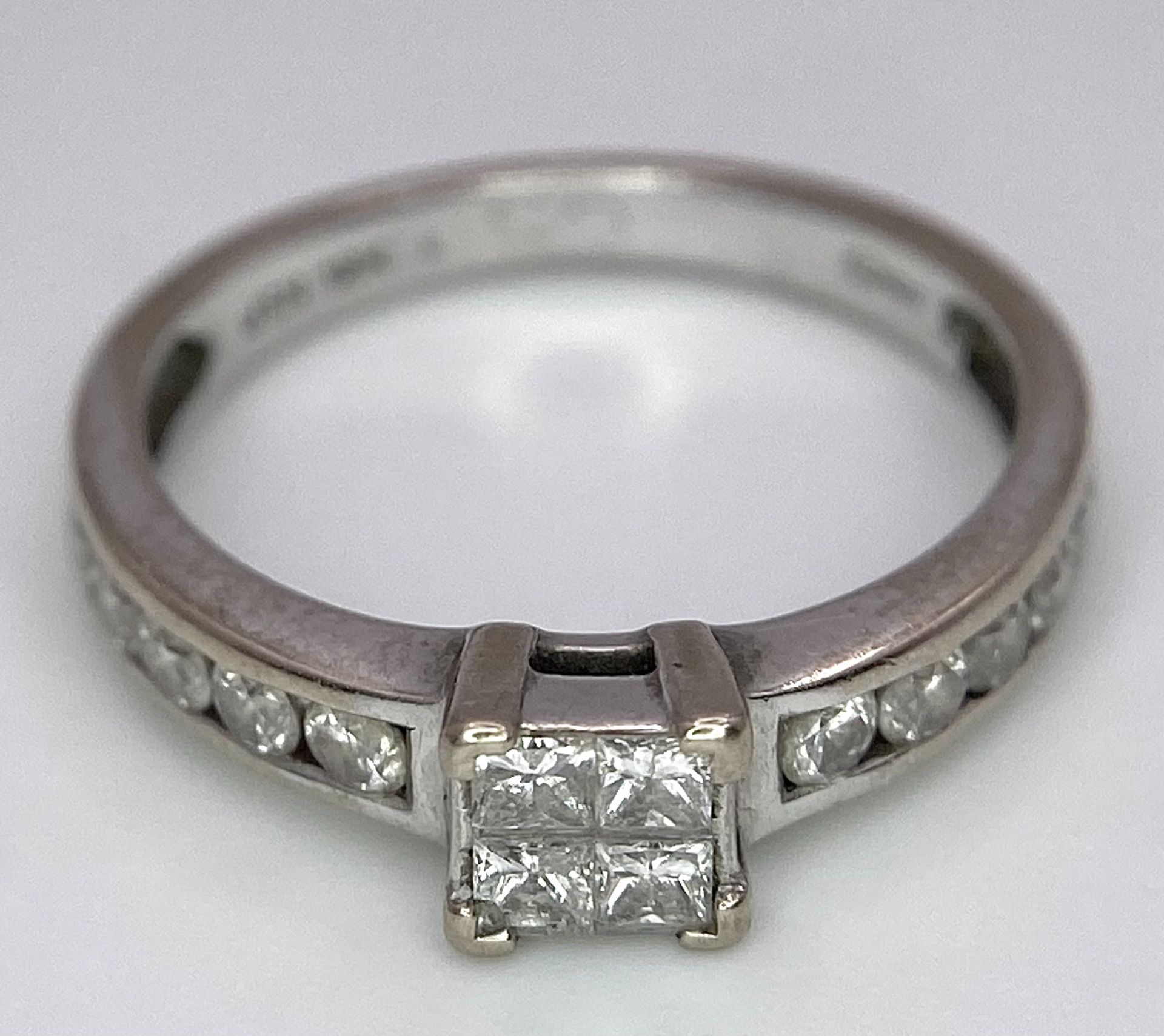 An 18K White Gold and Diamond Ring. Square and round cut diamonds. Size J. 2.6g total weight. - Image 3 of 7