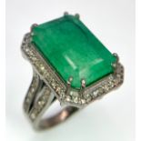 An 11.45ct Emerald Dress Ring with 0.90ctw of Diamond Accents. Set in 925 Silver. Size M. 8.2g total