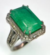 An 11.45ct Emerald Dress Ring with 0.90ctw of Diamond Accents. Set in 925 Silver. Size M. 8.2g total