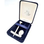 A Vintage Sterling Silver Golf Tee and Ball Marker. Comes in original presentation case.