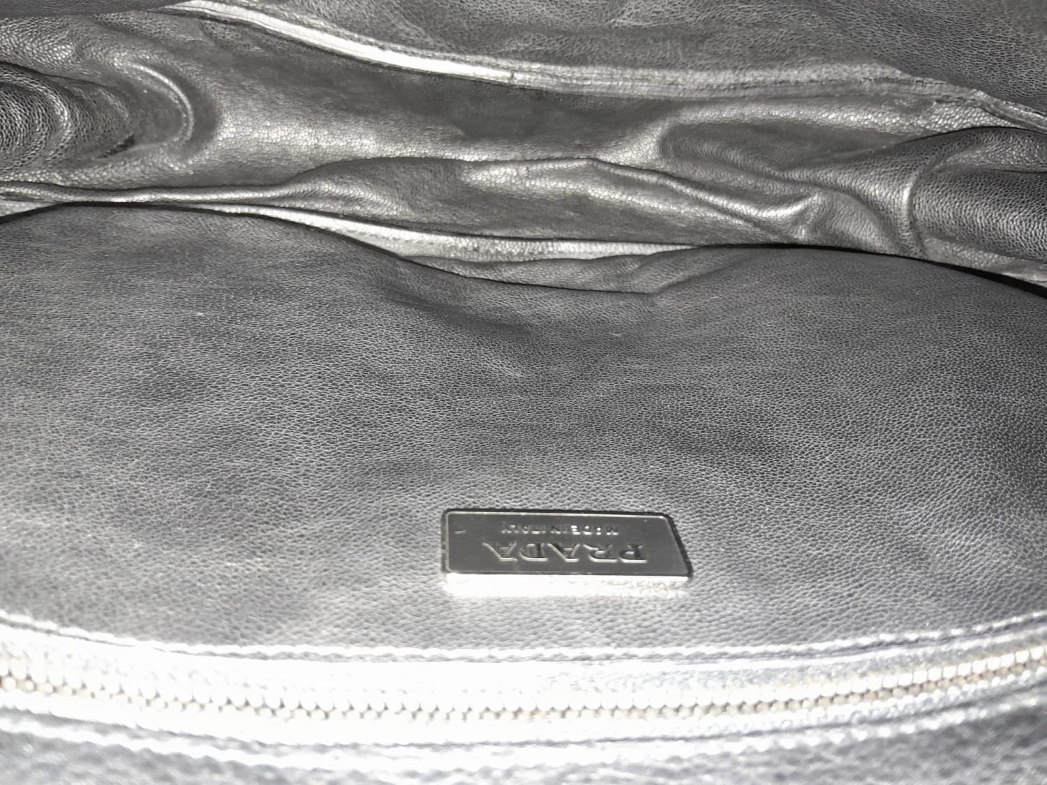 A Prada Black Leather Crossbody Satchel Bag. Textured exterior with buckled flap. Spacious leather - Image 8 of 14