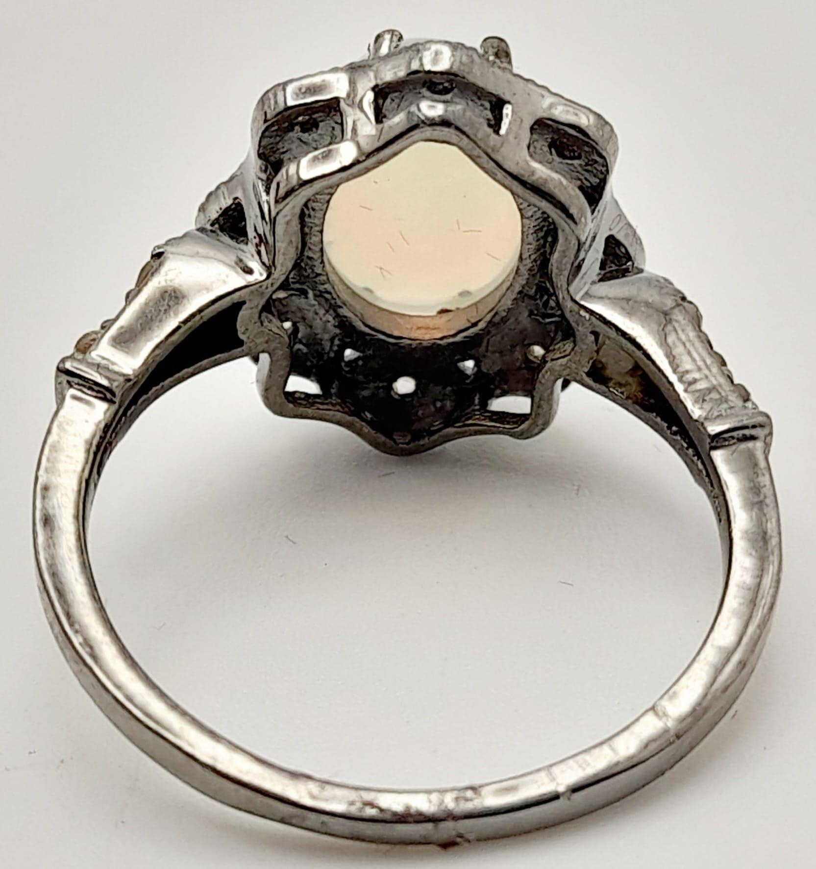 An Ethiopian Opal Ring with Rose Cut diamond Surround and Accents. Set in 925 Sterling silver. - Image 3 of 5