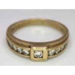 A Vintage 9K Yellow Gold Diamond Half-Eternity Ring. Belt buckle design. Size R. 3.7g total weight.