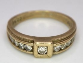 A Vintage 9K Yellow Gold Diamond Half-Eternity Ring. Belt buckle design. Size R. 3.7g total weight.