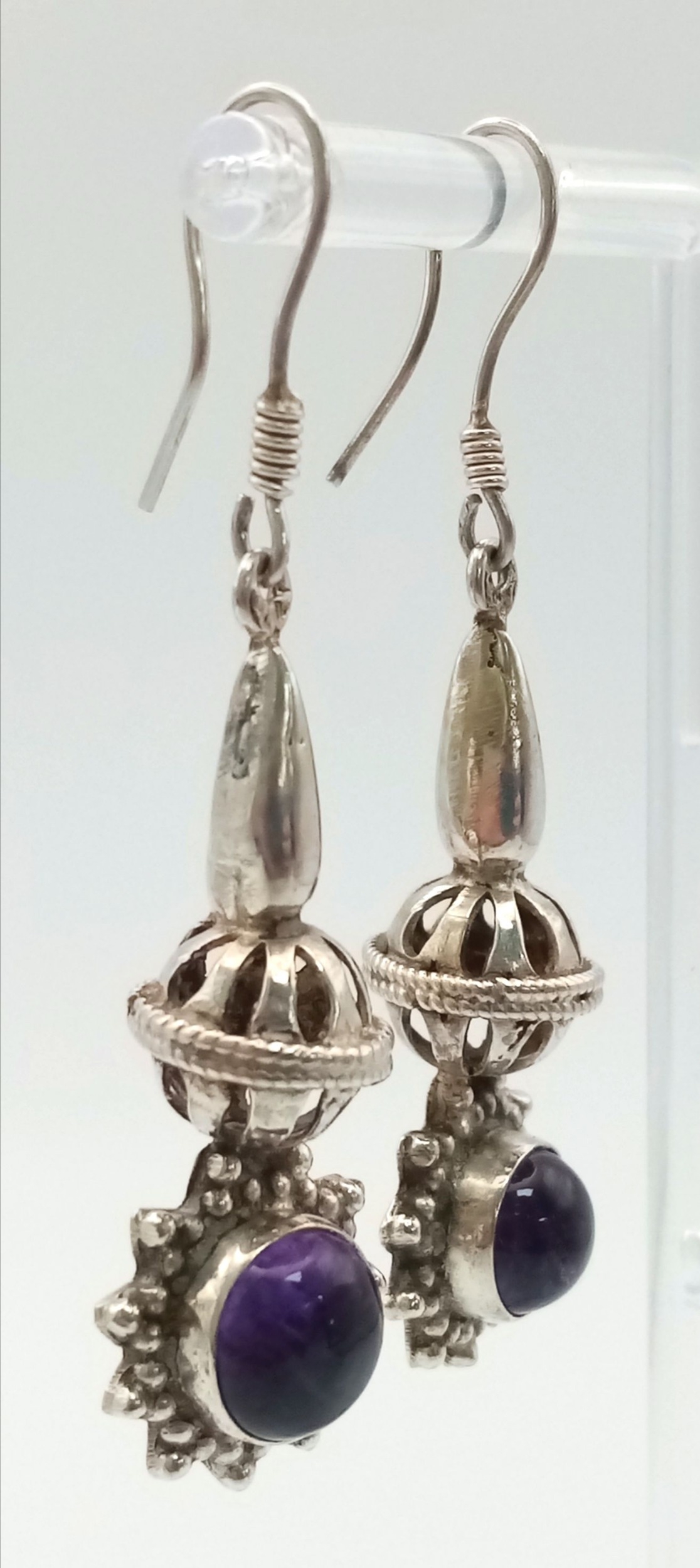 A Pair of Sterling Silver and Amethyst Drop Earrings. Decorative 4cm drops with amethyst cabochons. - Image 3 of 5