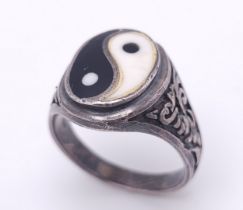 A vintage 925 silver Yin & Yang enamel ring with further decoration on shoulder. Total weight 12.4G.