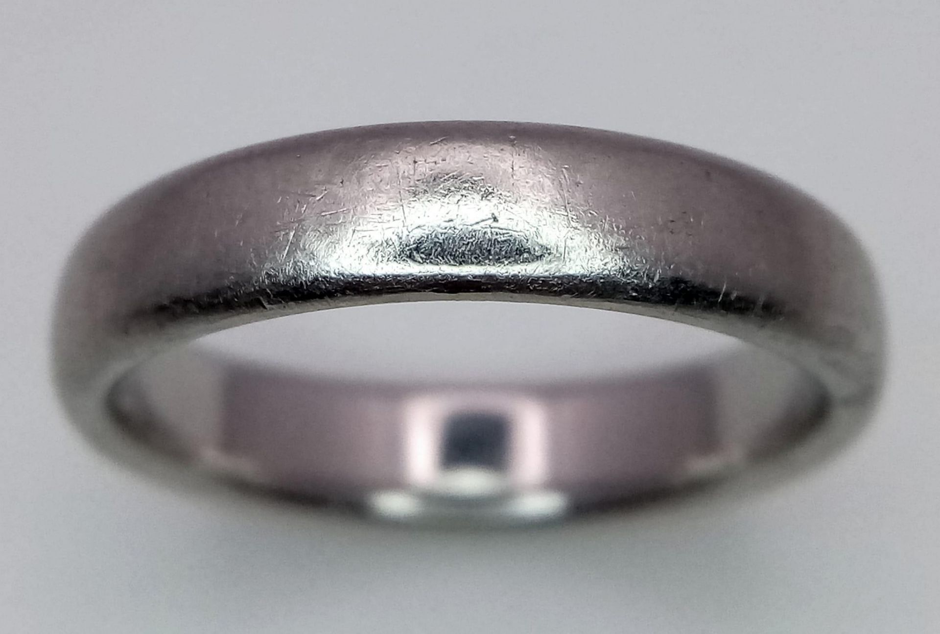 A Tiffany and Co Platinum 4mm rounded band ring. 9.3g. Size Q. - Image 2 of 4