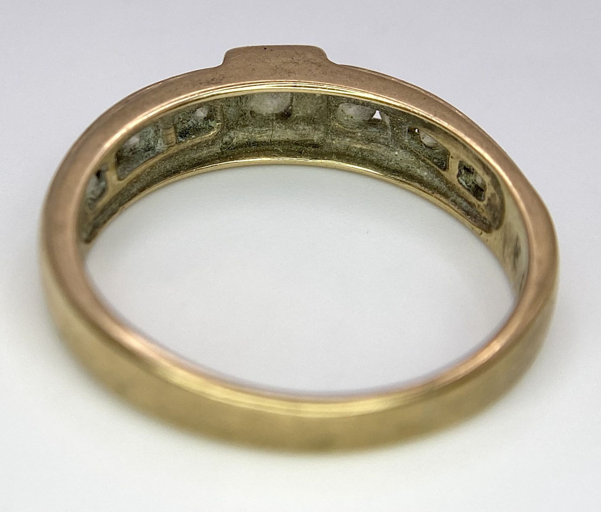 A Vintage 9K Yellow Gold Diamond Half-Eternity Ring. Belt buckle design. Size R. 3.7g total weight. - Image 5 of 6