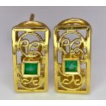 A Pair of 18K Yellow Gold and Emerald Earrings. Clip clasp with pierced decoration. 17mm. 3.9g total
