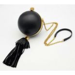 An Alexander Mcqueen Skull Ball Clutch Bag. Black leather exterior with gold tone hardware.