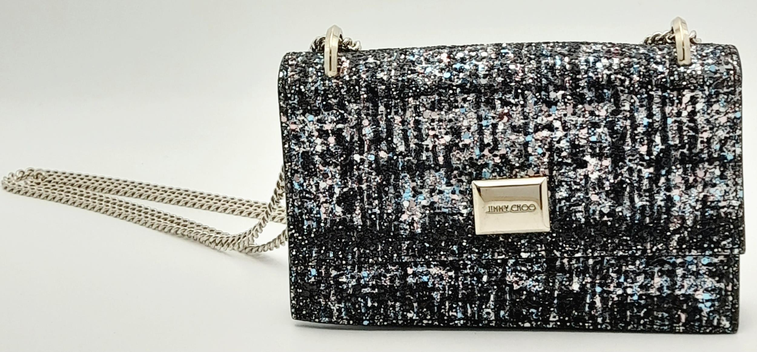 A Jimmy Choo 'Leni' Glitter Crossbody Bag. Black leather and blue, pink and black glitter exterior