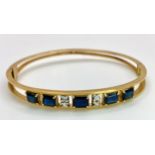 A 14K (TESTED AS) YELLOW GOLD BANGLE SET WITH 5 SAPPHIRES AND 4 DIAMONDS, 6CM DIAMETER, 15.9G (DIA: