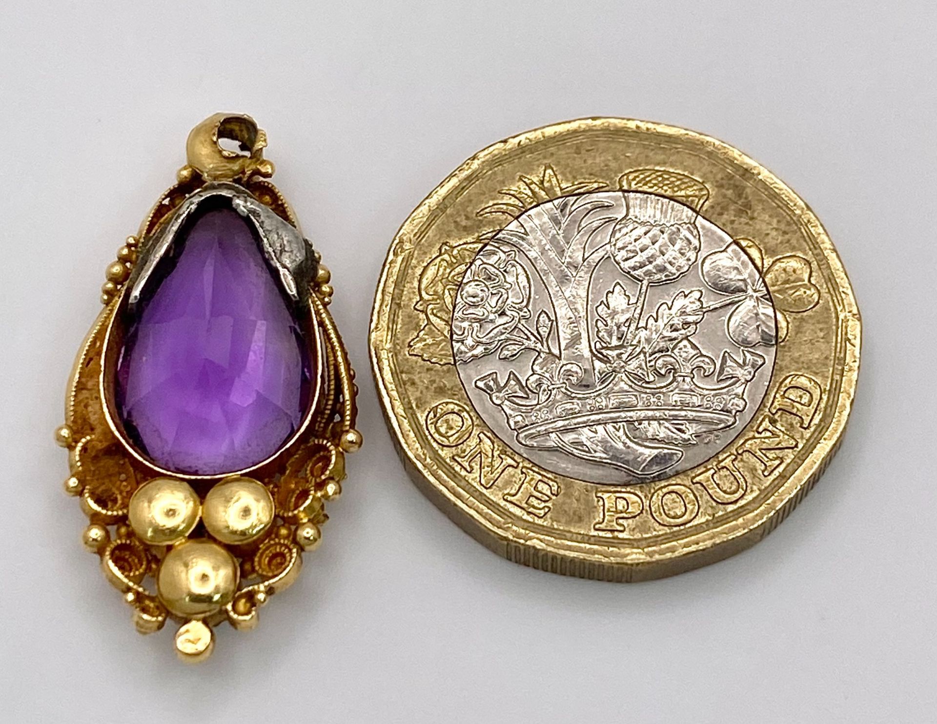 An Antique 18K Gold (tests as) Amethyst and Seed Pearl Pendant. 2.5cm. 3.3g total weight. - Image 4 of 4