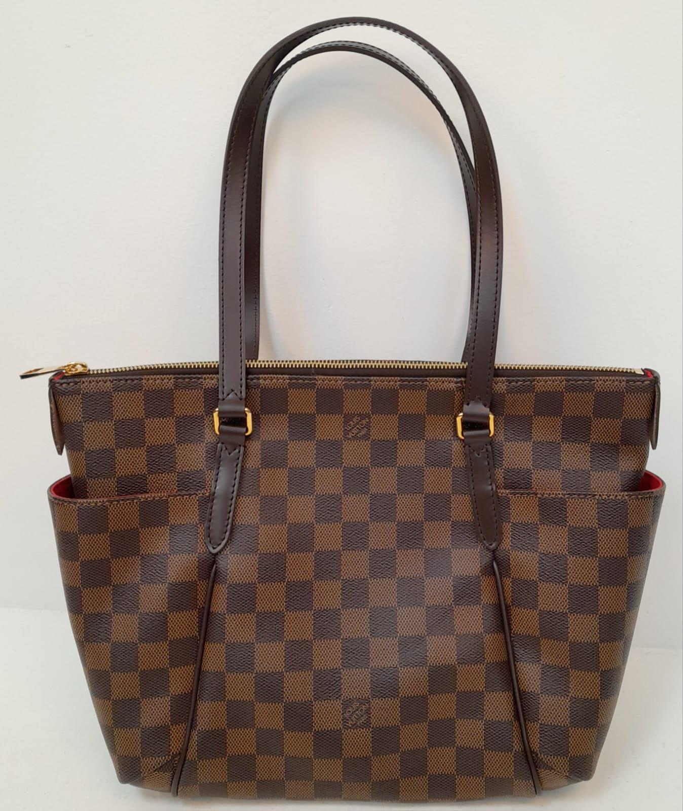 A Louis Vuitton Damier Ebene 'Totally PM' Shoulder Bag. Leather exterior with gold-toned hardware,