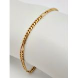 A 14K GOLD HERRINGBONE LINKED BRACELET . 5.2gms 22cms