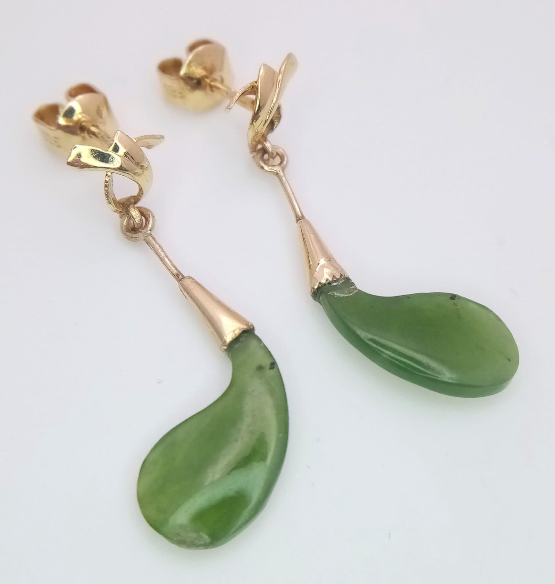 A Pair of 14K Yellow Gold and Jade Earrings. 2.4g total weight.