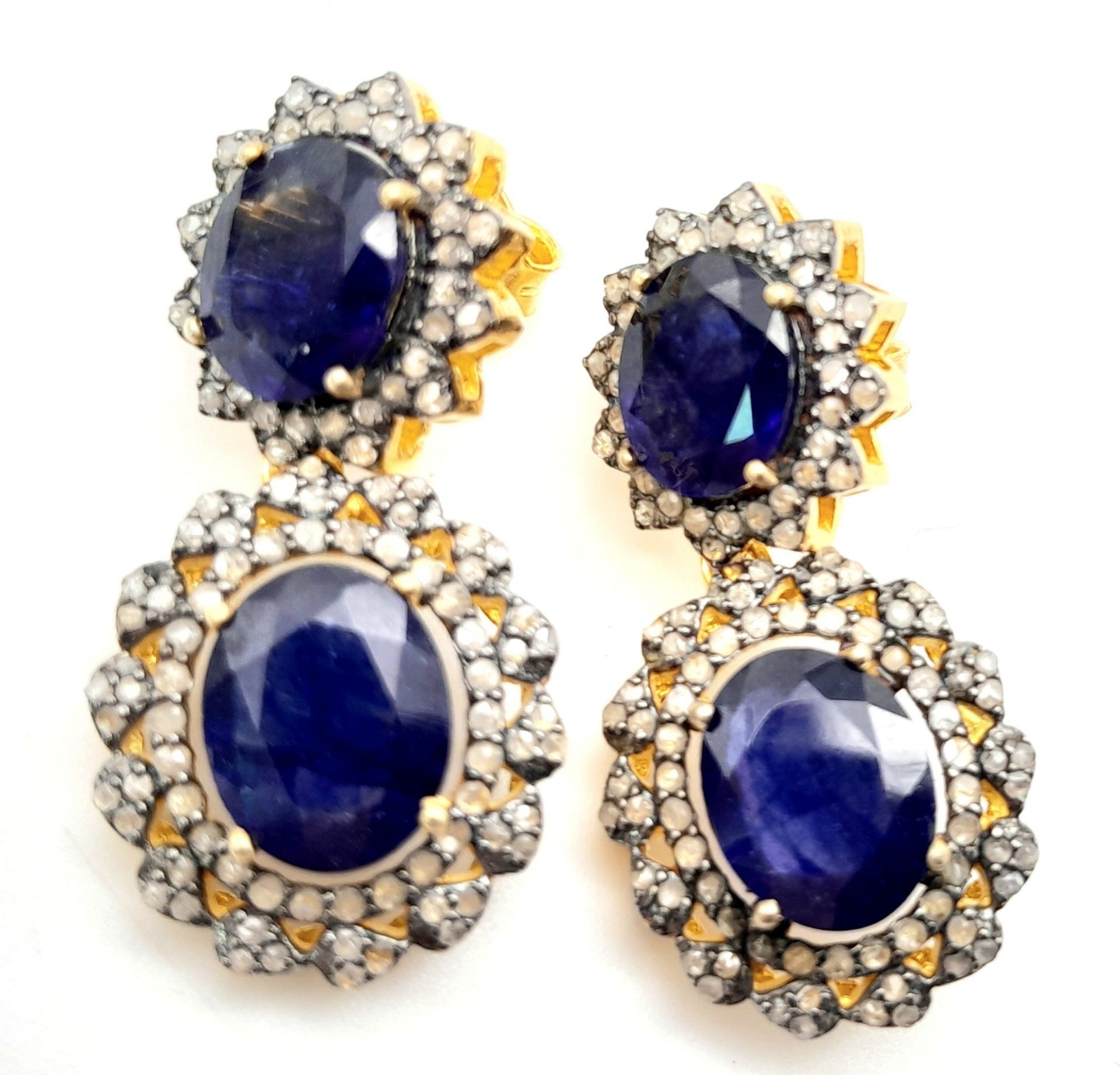 A Pair of Blue Sapphire Gemstone Drop Earrings with Diamond Surrounds. Set in gilded 925 Silver.