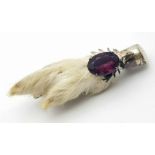 A Vintage Scottish Grouse Foot Brooch. Purple gemstone decoration. 8cm.