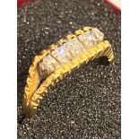 18 carat GOLD RING having five DIAMONDS set to top in split Shoulder mount. DIAMONDS are Round