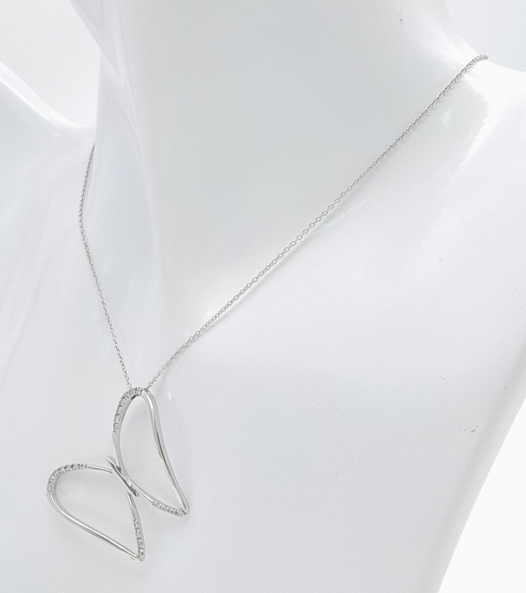 A 18ct White Gold Diamond Butterfly Necklace, 0.08ct diamond, 16” length, 4.6g weight, approx 32mm x - Image 3 of 5