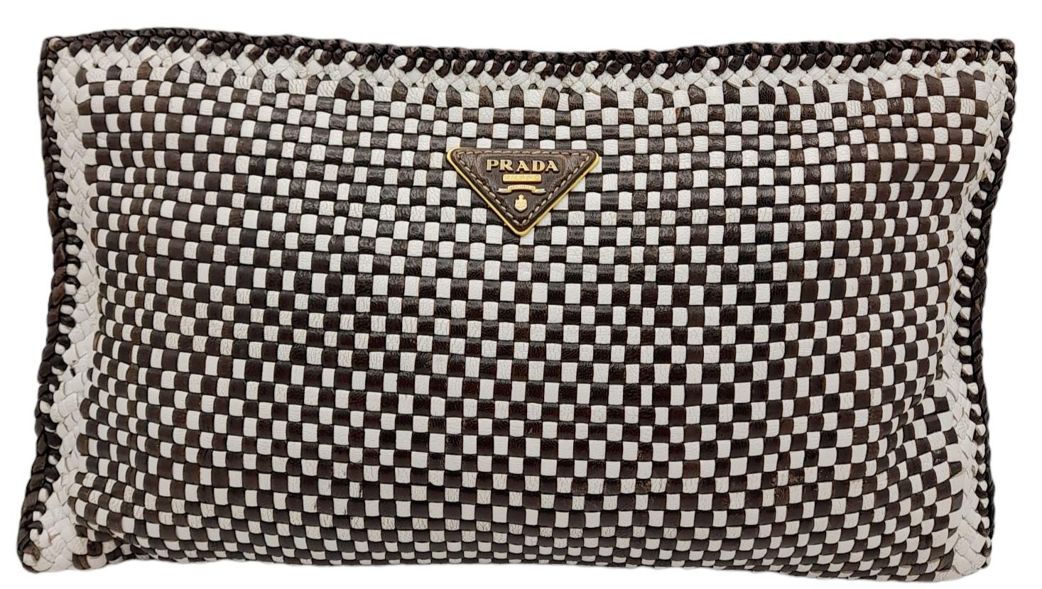 A Prada Black and White 'Madras' Clutch Bag. Woven leather exterior with gold-toned hardware and