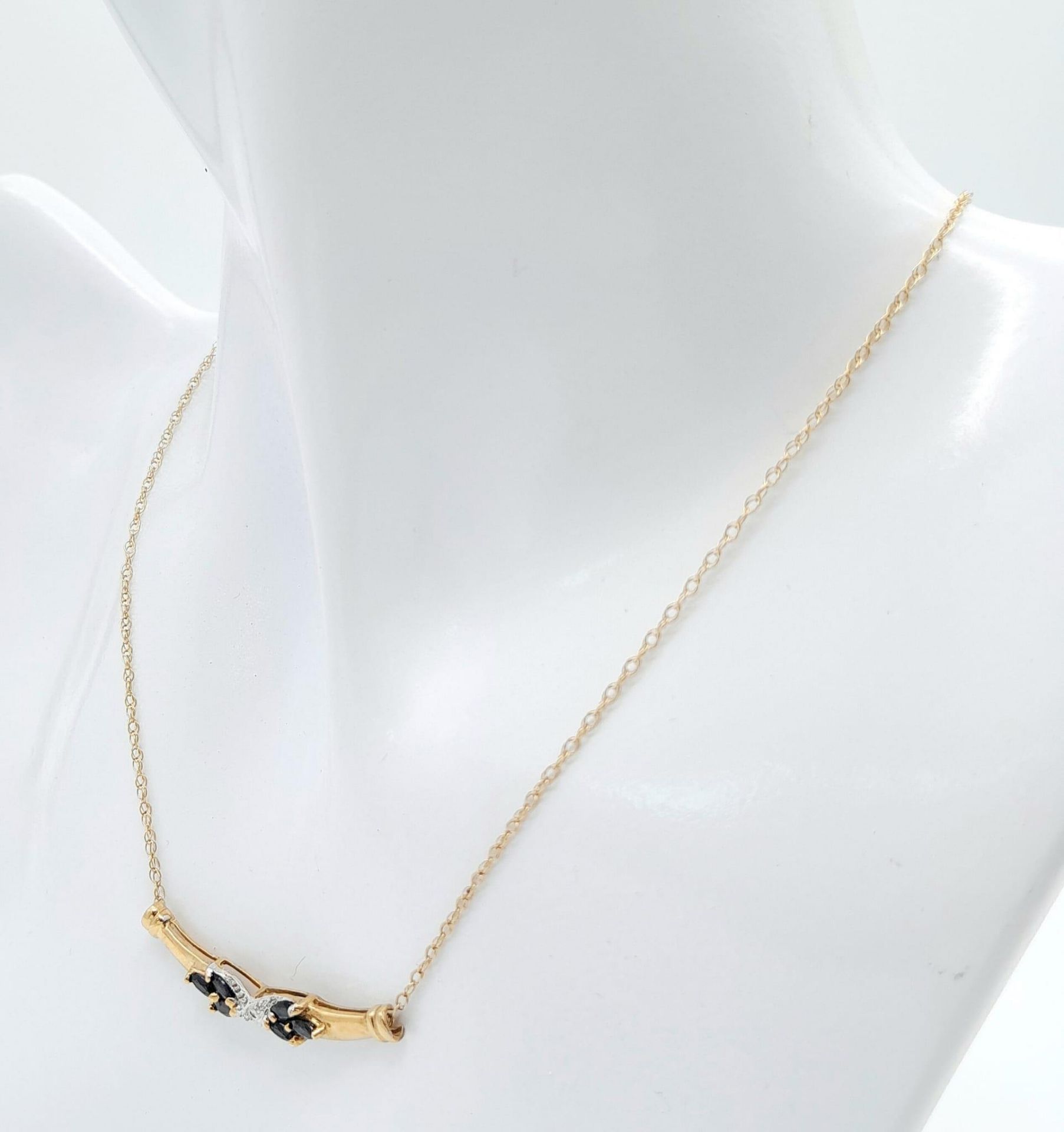 A 9 Carat Yellow Gold Diamond and Sapphire Set Necklace. 45 cm Length. Set with a Centre Round Cut - Image 3 of 5