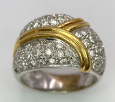 An 18K White and Yellow Gold Diamond Cluster Ring. Three small fields of diamonds separated by