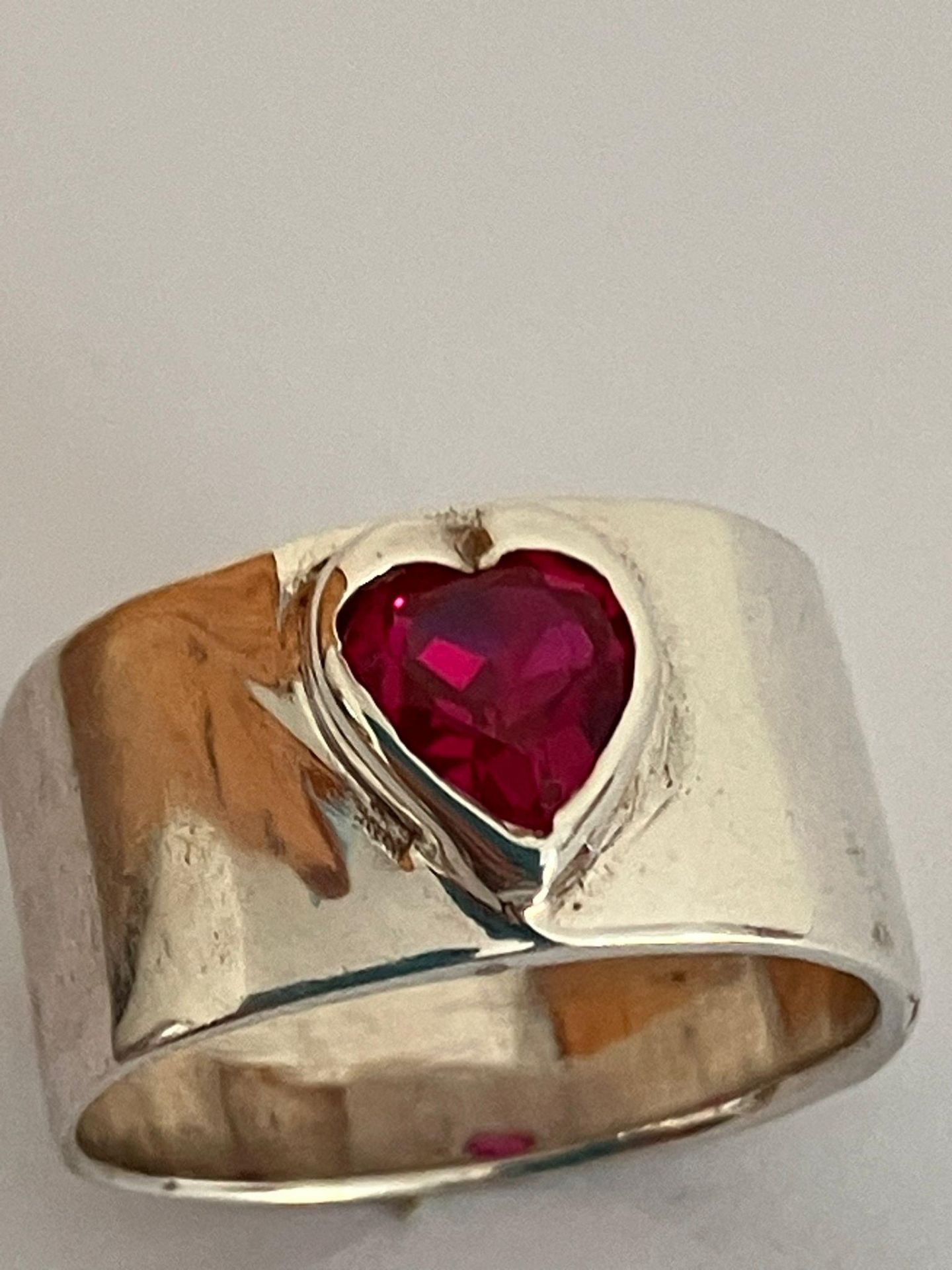 Vintage SILVER and RUBY SOLITAIRE RING.Having a heart shaped RUBY set to top on a wide SILVER band - Image 2 of 2