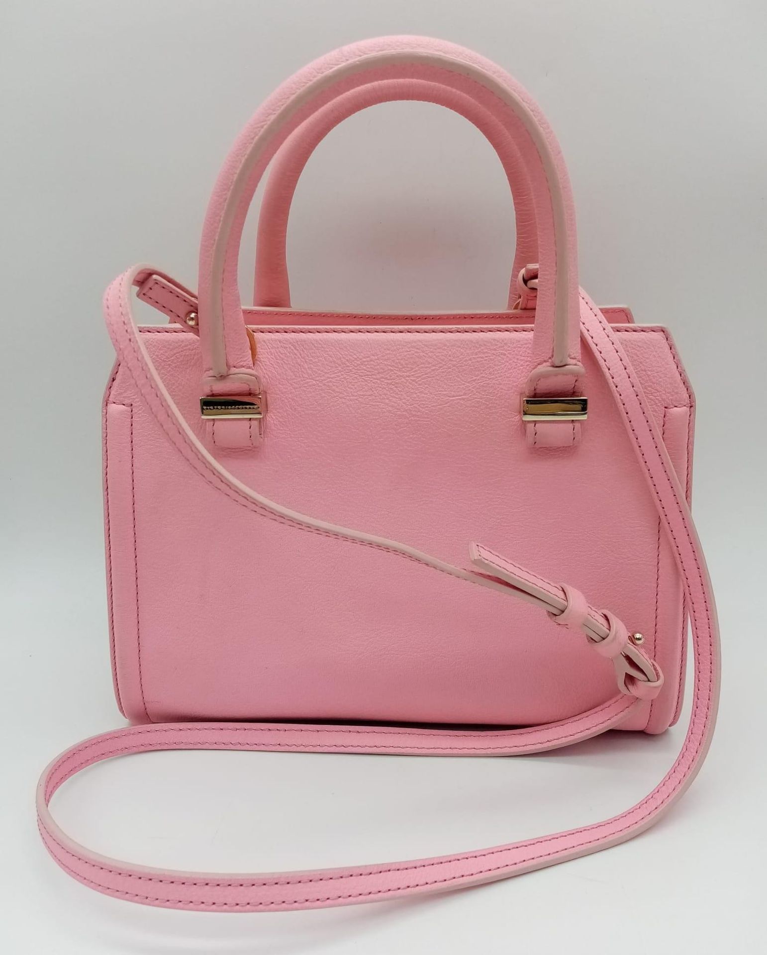 A Victoria Beckham two toned candy pink textured leather mini bag, patent leather trim with gold