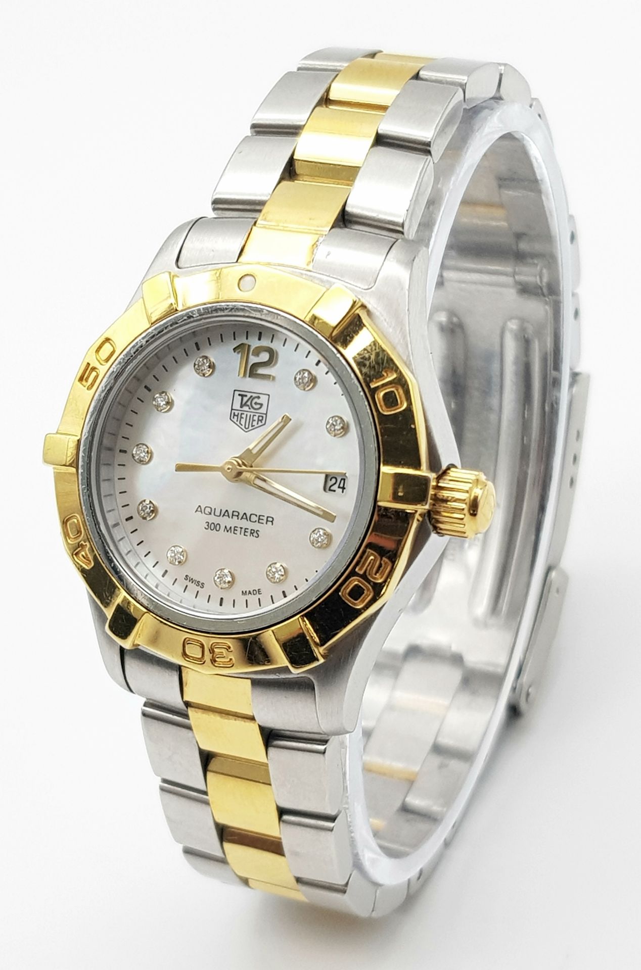 A TAG-HEUER LADIES BI-METAL "AQUARACER" WITH MOTHER OF PEARL DIAL AND DIAMOND NUMERALS , COMES IN