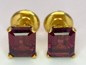 A Pair of 18K Yellow Gold and Alexandrite Earrings. Emerald cut alexandrite - 5ctw. 5.7g total