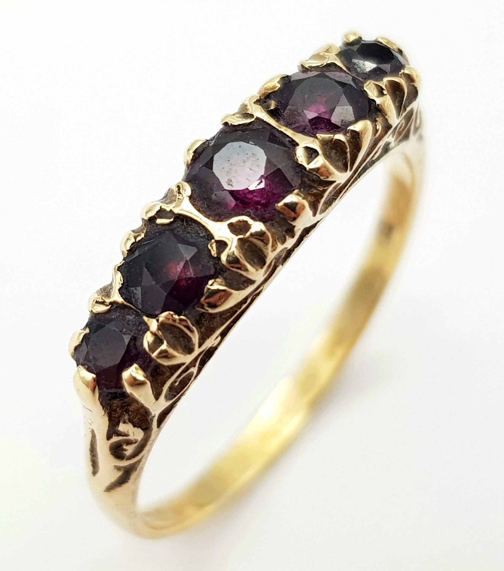 A Vintage 9K Yellow Gold Five Stone Garnet Ring. Size R. 2.8g total weight.