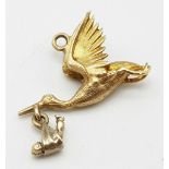 A 9K Yellow Gold Stork and Baby Pendant/Charm. 25mm. 2.35g weight.