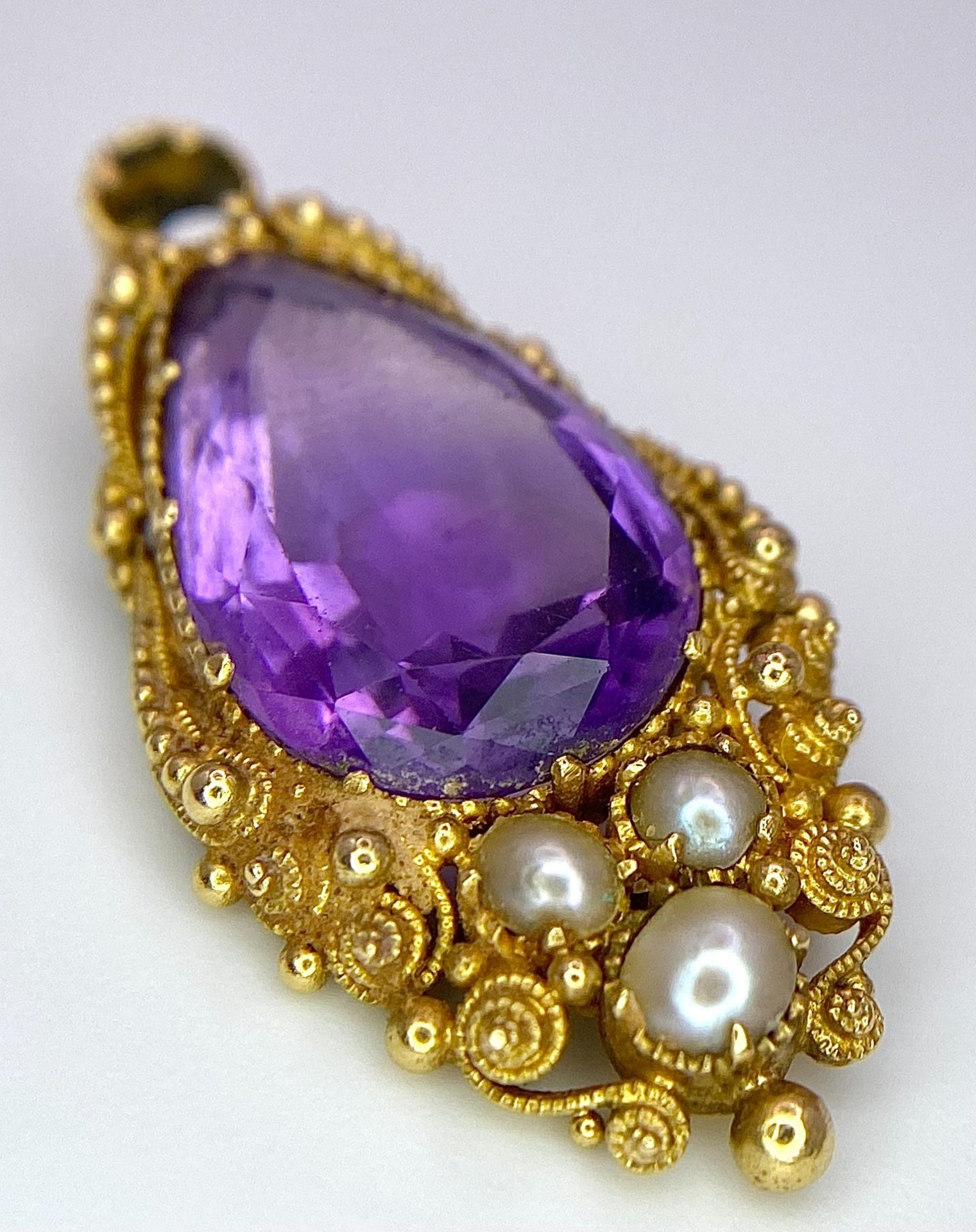 An Antique 18K Gold (tests as) Amethyst and Seed Pearl Pendant. 2.5cm. 3.3g total weight.