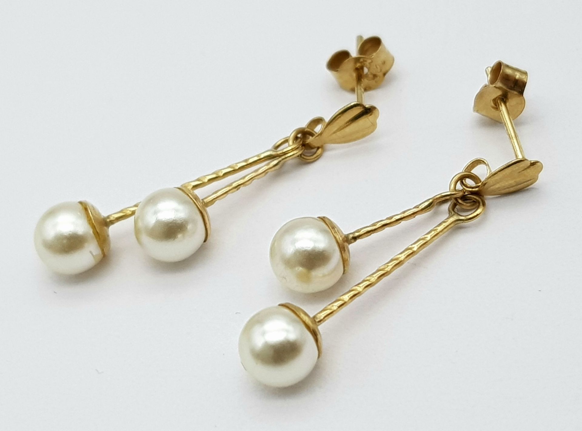 A 9ct Yellow Gold Double Drop Pearl Studs, 4mm pearl size, 0.9g weight, approx 2.5cm drop ref: - Image 2 of 4