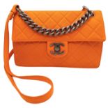 A Chanel Orange Quilted Caviar Leather Retro Shoulder Bag. Front flap with CC turn-lock and