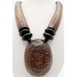 An East African talisman’s necklace, made with snakeskin and other materials, used by voodoo doctors