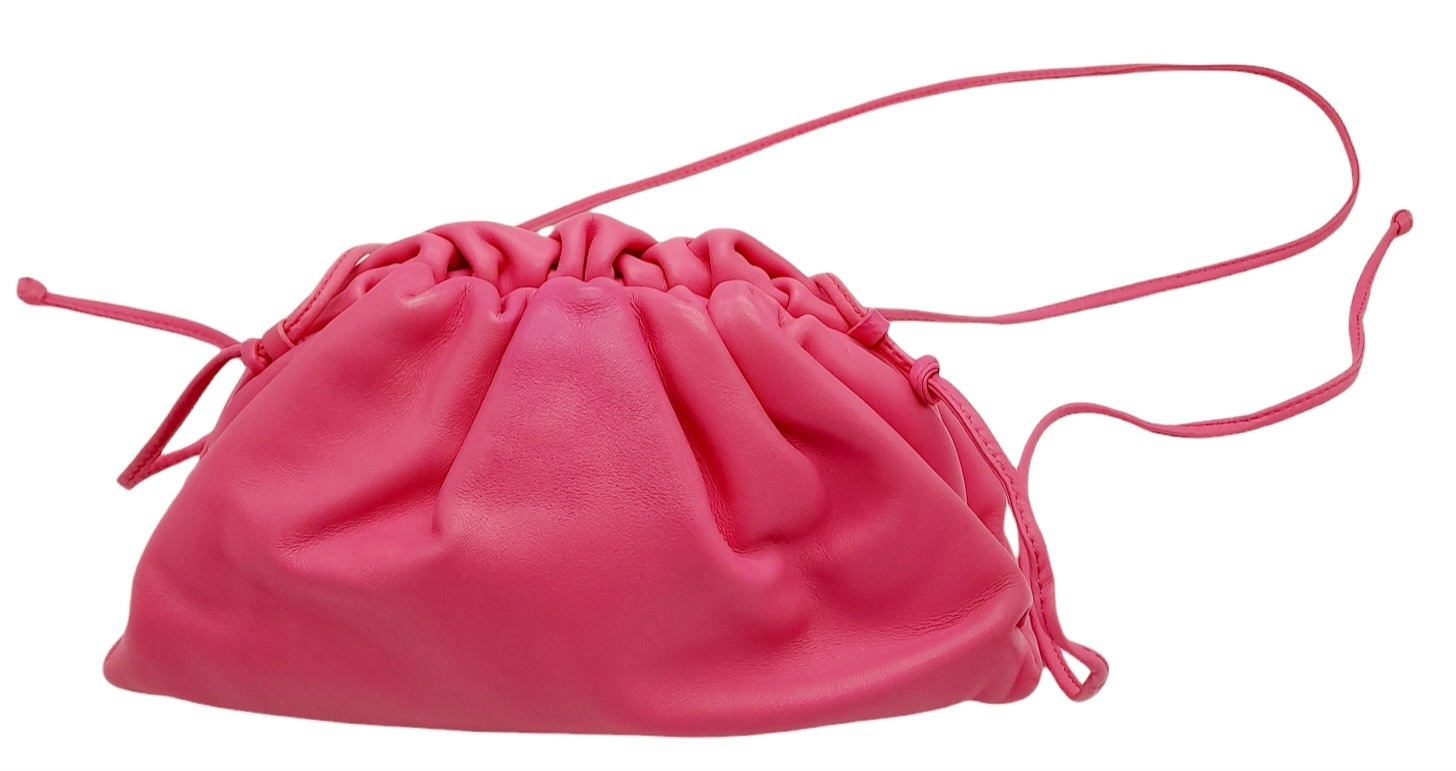 A Bottega Veneta Pink Mini Pouch Bag. Leather exterior with thin strap and magnetic closure. Pink - Image 5 of 9