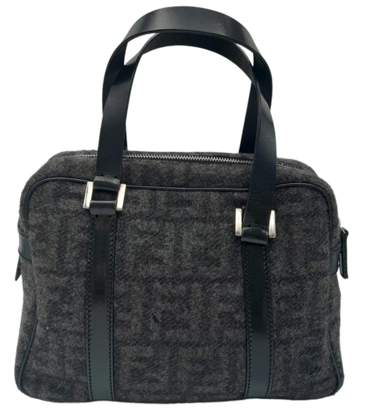 A Fendi Black and Charcoal Grey Bag. Textile exterior with black leather handles, silver-toned