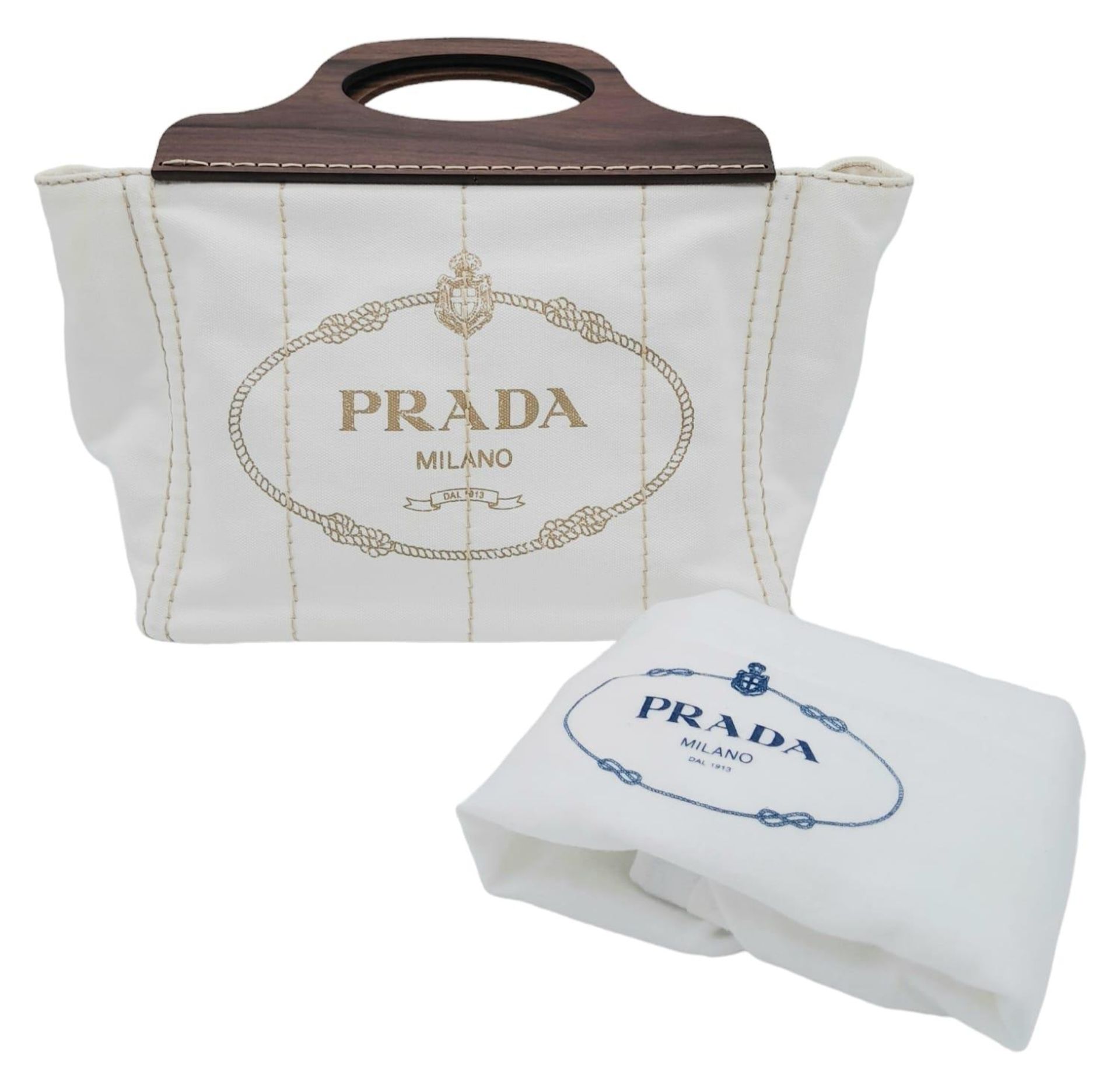 A Prada White Exteriors with Brown Wooden Handle Logo-printed Striped Tote Bag. Vertical - Bild 2 aus 9