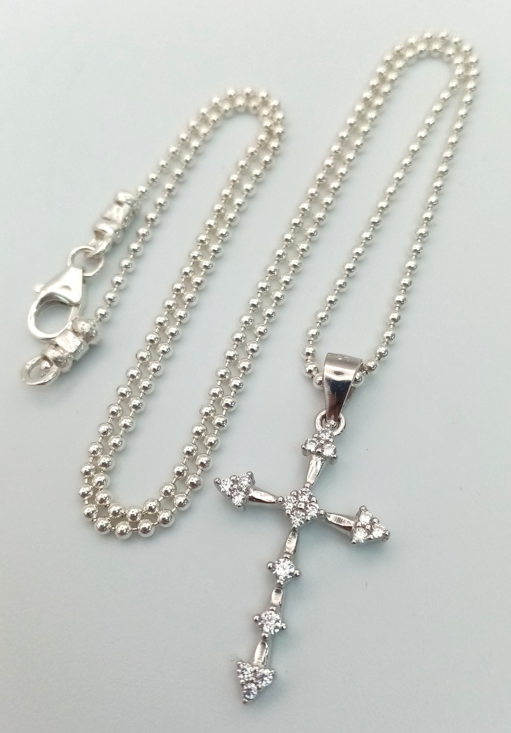A 925 Silver Cross Pendant on a 925 Silver Chain. 3cm and 40cm.